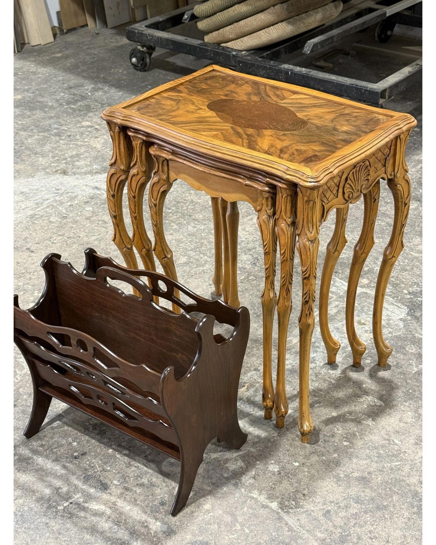 Ornate nesting table with marquetry design and carved legs